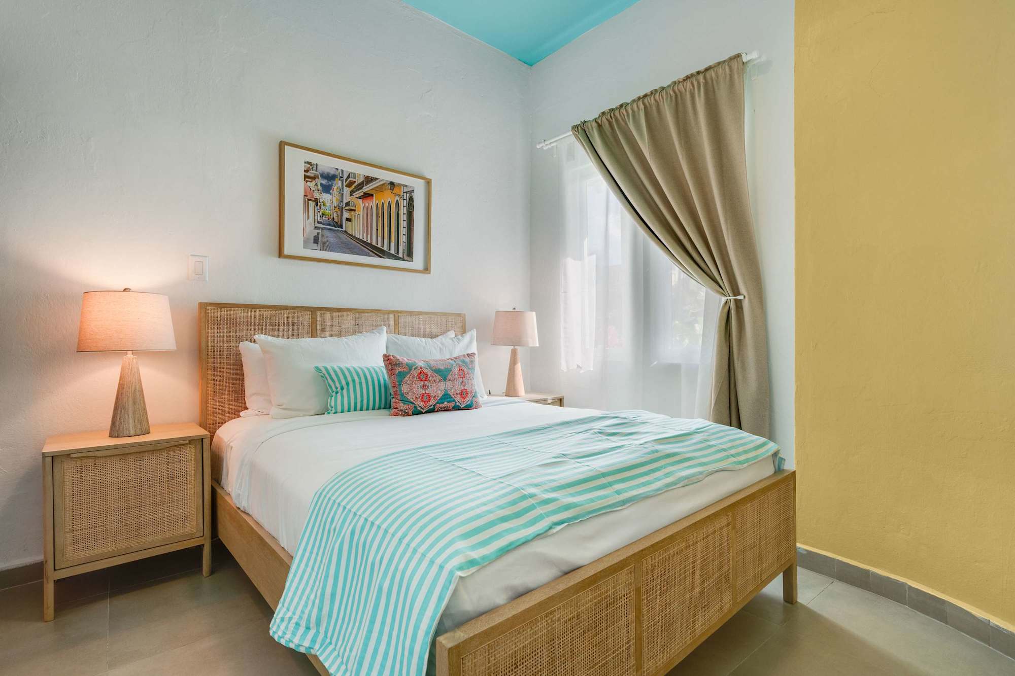 Queen bedroom with rattan headboard