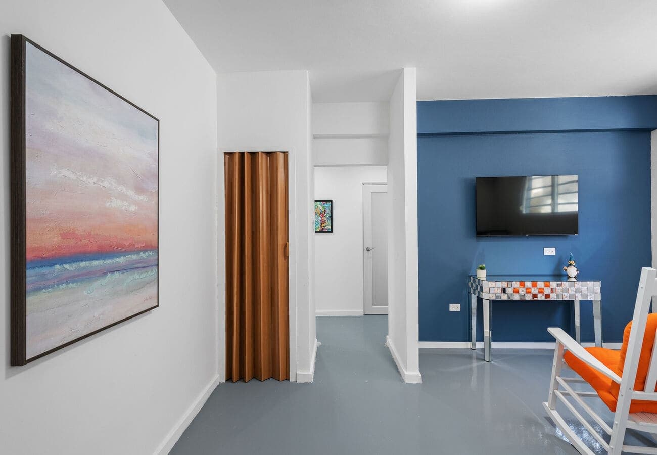 Open living area with sunset art