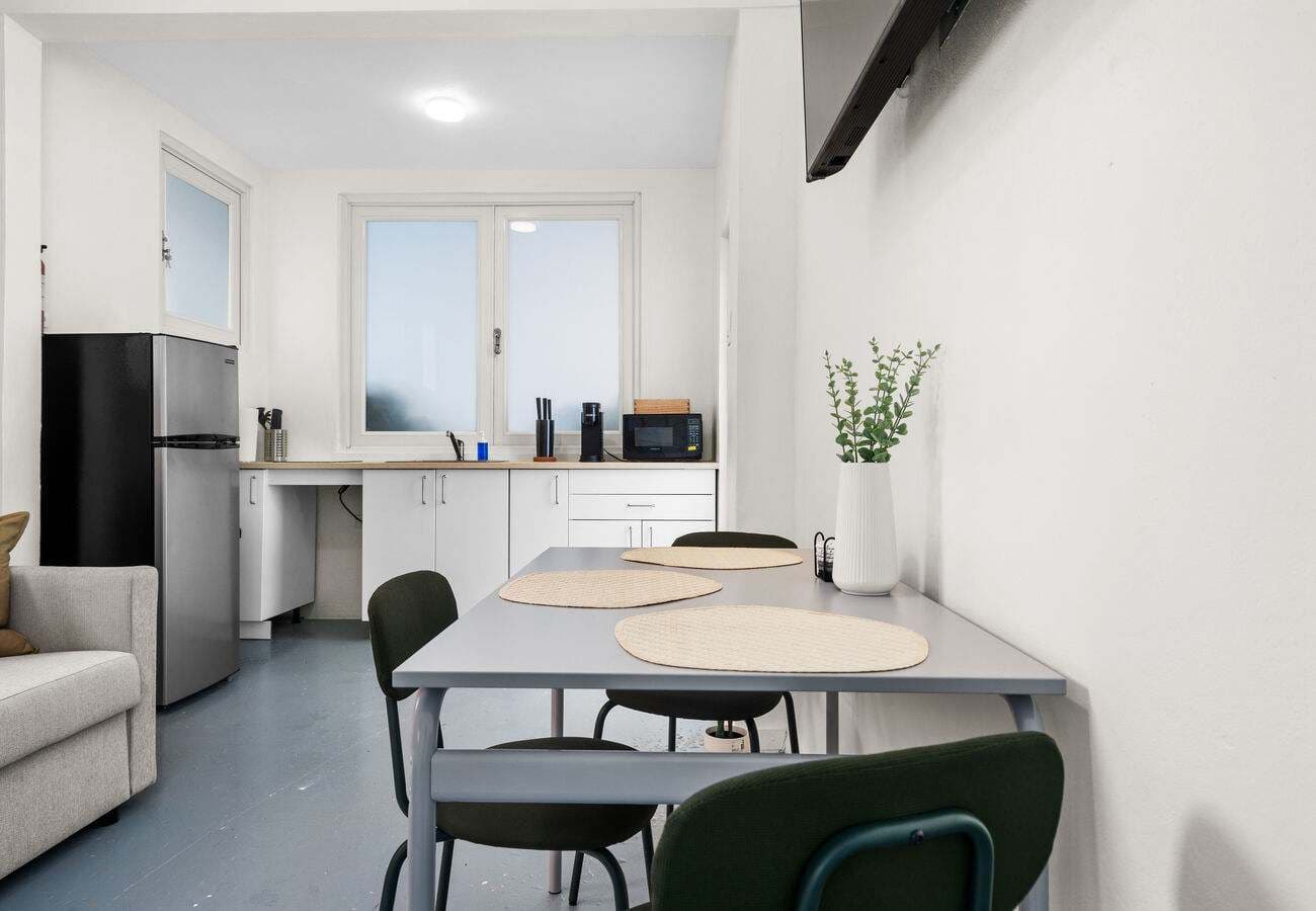 Kitchen with full-size fridge, microwave & dining for 3