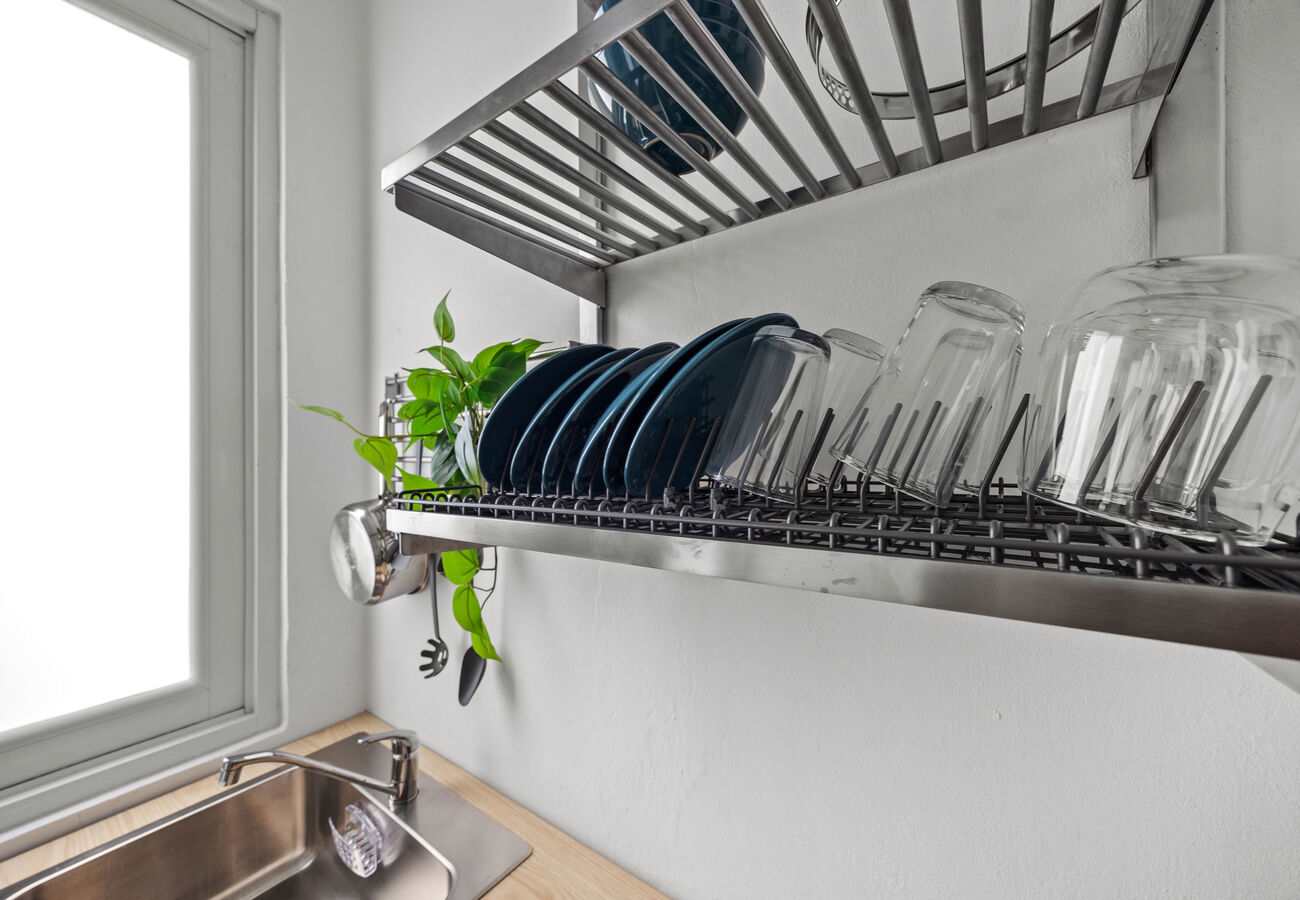 Dishes, glasses & drying rack ready to use