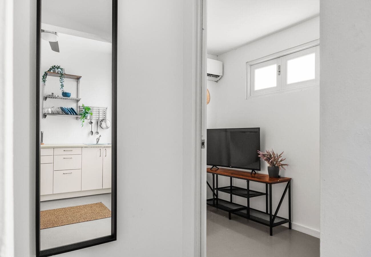 Full-length mirror and bunk room entry