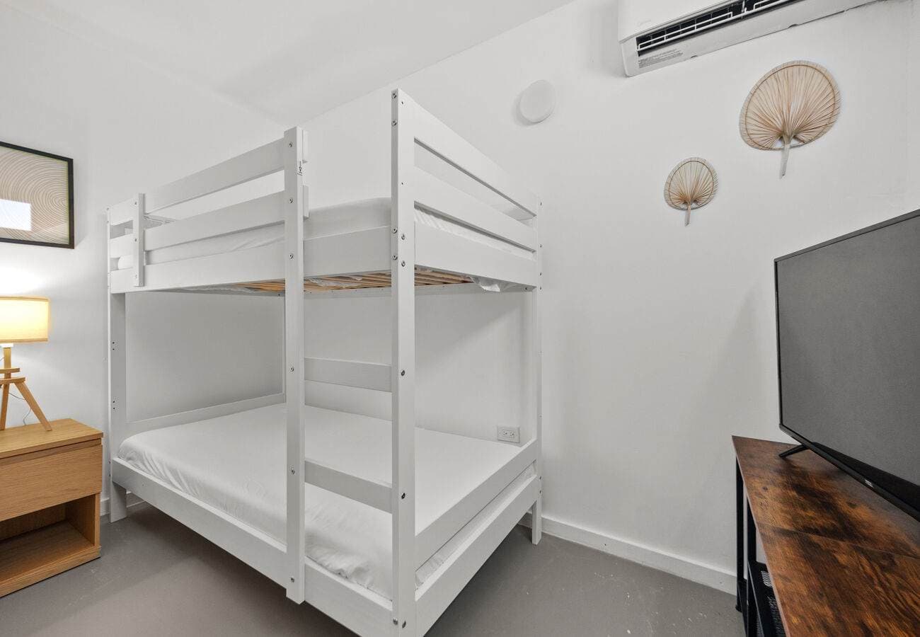 Bunk bed nook with bedside lamp