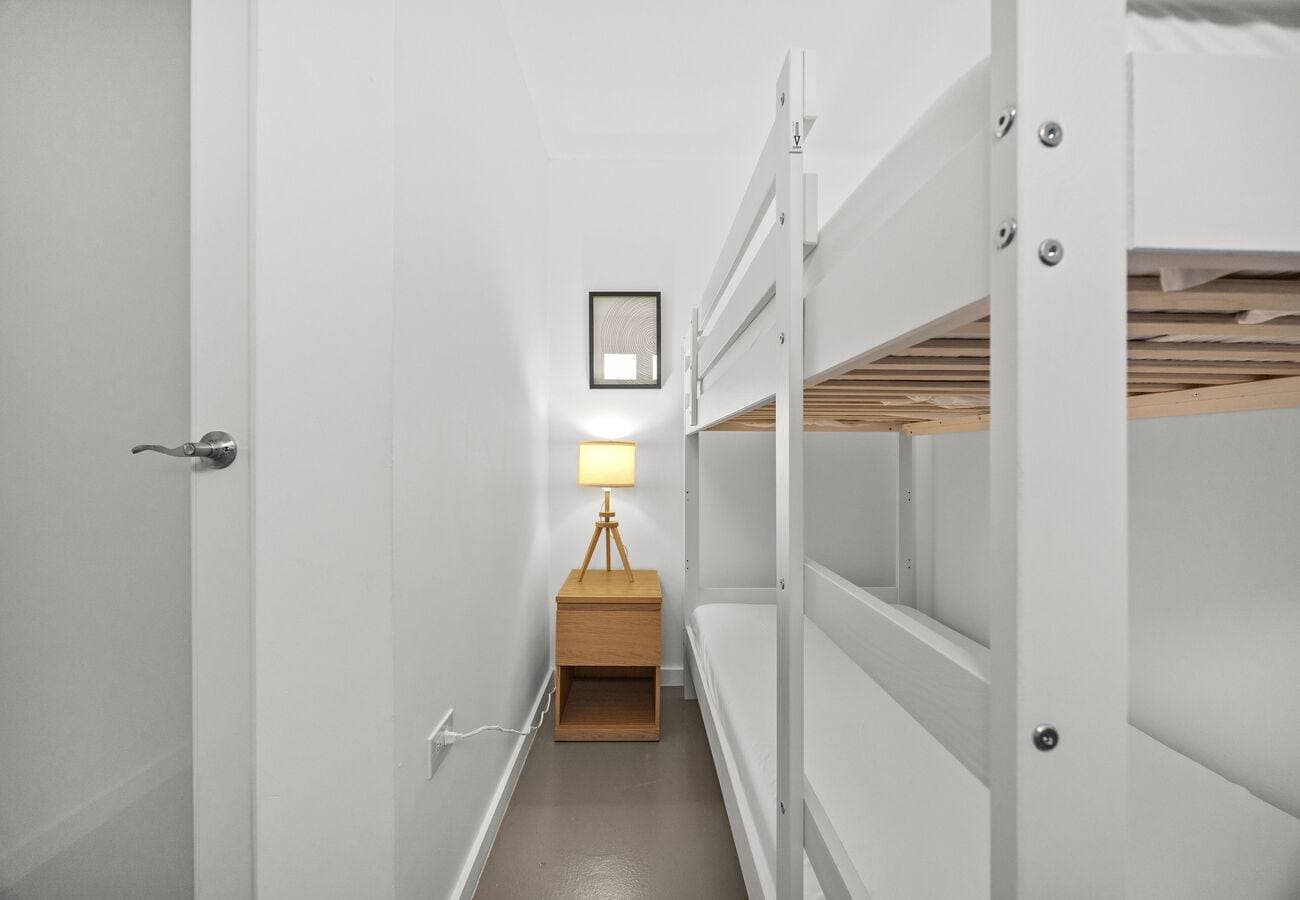 Bunk bed nook with bedside lamp