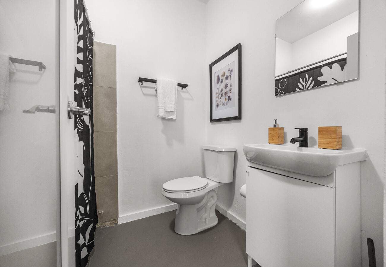 Full bathroom with walk-in shower & toiletries