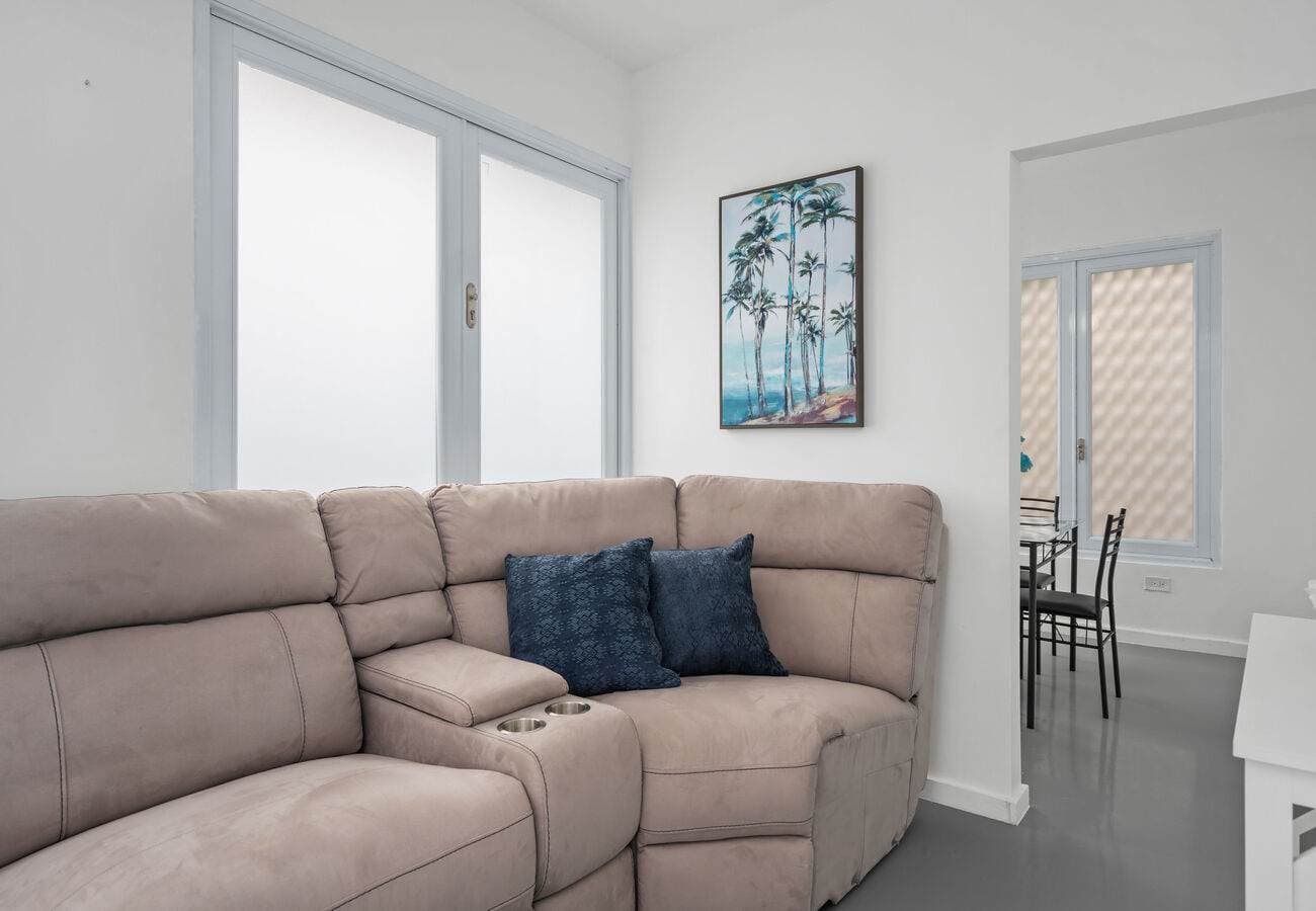 Sectional sofa with cup holders and palm art