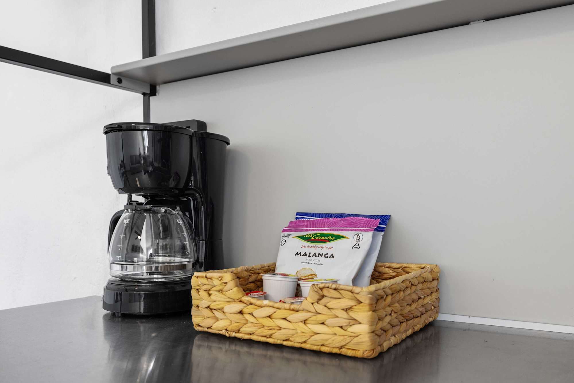 Coffee maker with complimentary local coffee