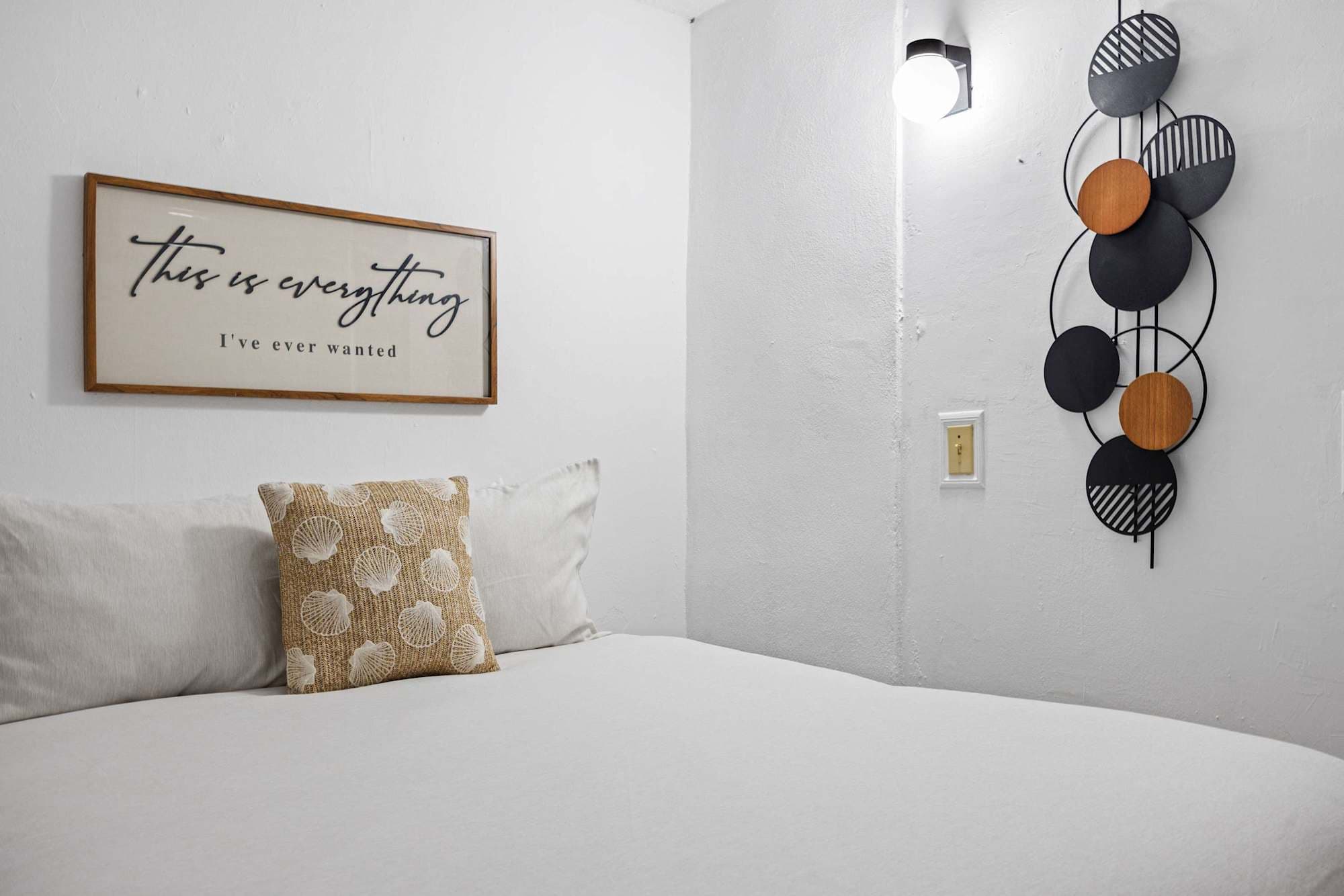 Queen bed with crisp white linens