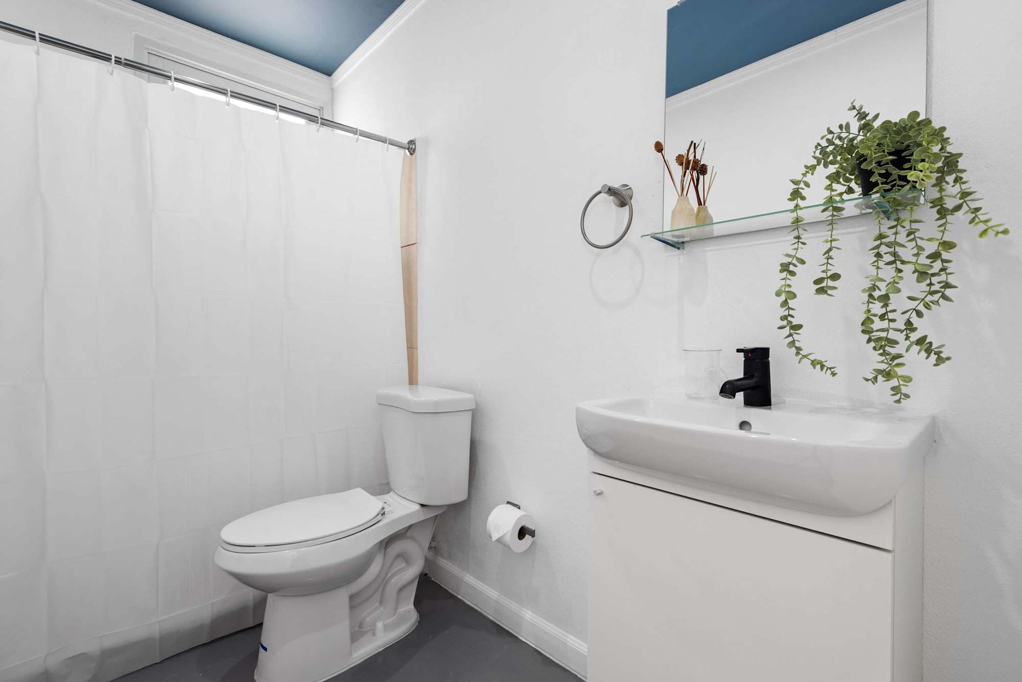 Clean full bathroom with shower & modern vanity